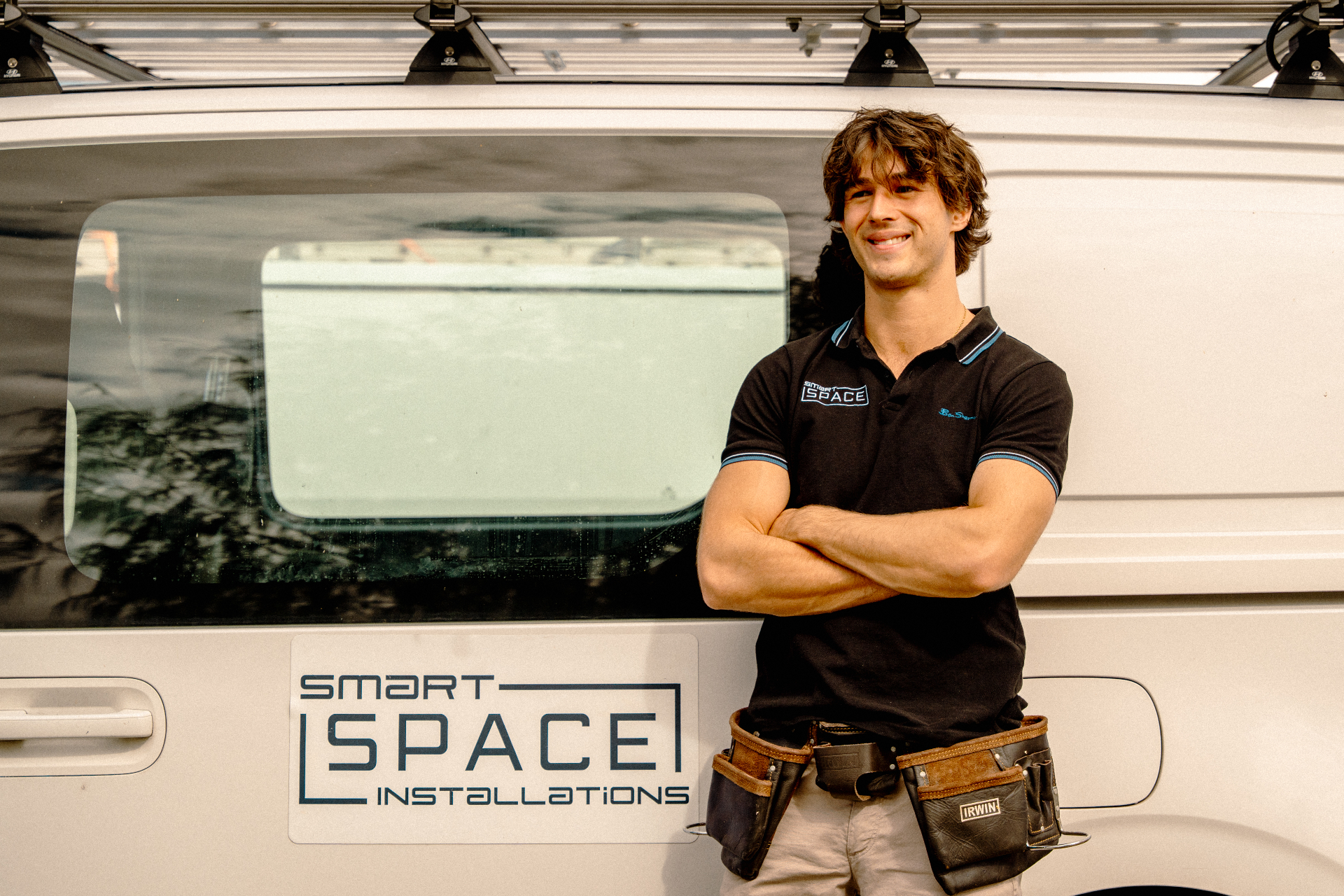 Smart Space installer beside branded van
